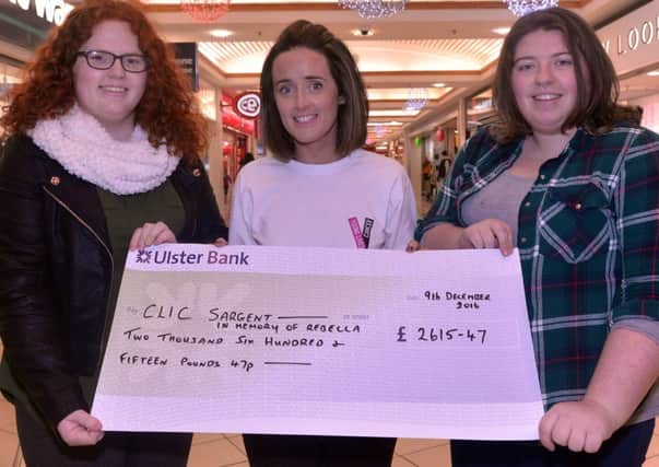 Pictured at the presentation of a cheque for Â£2615 to the Clic Sargent Cancer Charity are from left, Meabh McElmeel, Fiona McCann, fundraising manager, Clic Sargent, and Aine McGivern. The money was raised through an 18th birthday party in memory of the late Rebecca Haughey and was held at the Auction Rooms, Moy. INPT50-203.