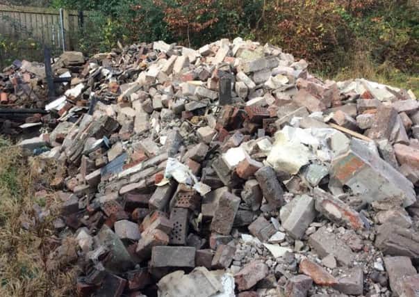 Some of the rubble which has been dumped in the Manse Road area. INNT 50-801CON