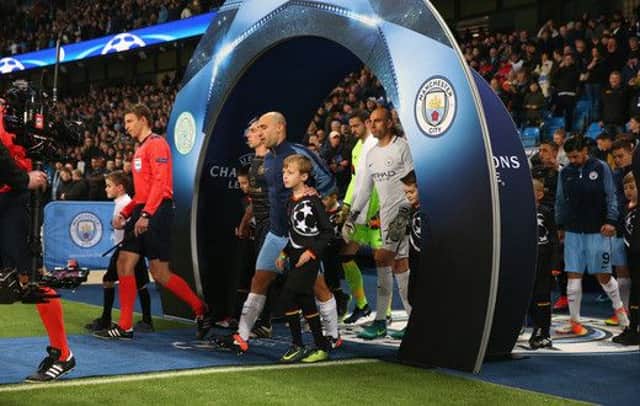 Zach Penny comes out of the tunnel onto the Etihad pitch with Manchester City right back Pablo Zabaleta