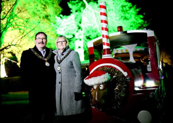 Mayor, Cllr John Scott and Mayoress, Audrey Scott, pictured beside the Christmas Train at the Enchanted Winter Garden. INNT 50-804CON