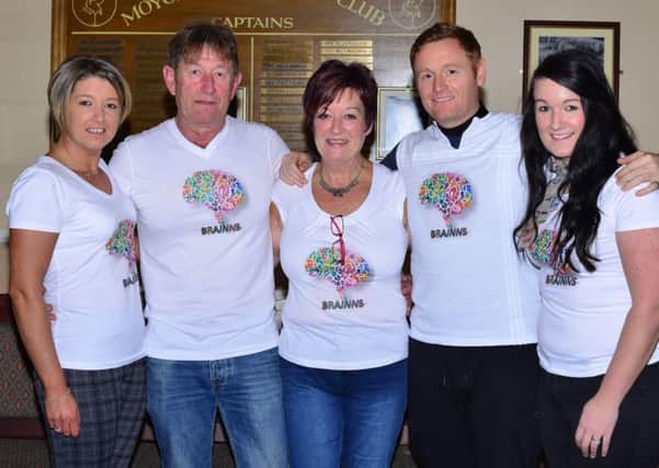 Relatives of Dougie Wylie who is suffering the rare brain disease, Isolated NeuroSarcaoidosis, pictured at the fundraising table quiz held in Moyola Golf Club on November 19 - Sharlene Hunter (sister), Eric and Barbara Wylie (dad and mum), Keith Wylie (brother) and Laura Gregg (sister). A spokesperson for the family have stated they were deeply overwhelmed with the turnout we had and the unbelievable amount raised - Â£5897.28. They have thanked Moyola Golf Club, Sam Crossett - Quiz Master, businesses who kindly donated gifts for the event and the public. (Submitted Pic) (by Jonathon Hudson).