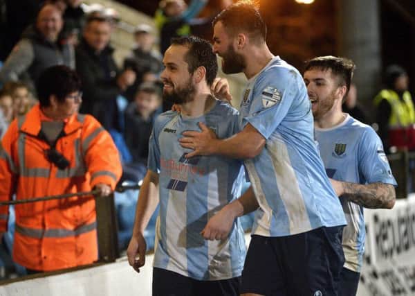 Ballymena's Tony Kane celebrates after he scored from the penalty spot to make it 1-0 against Coleraine