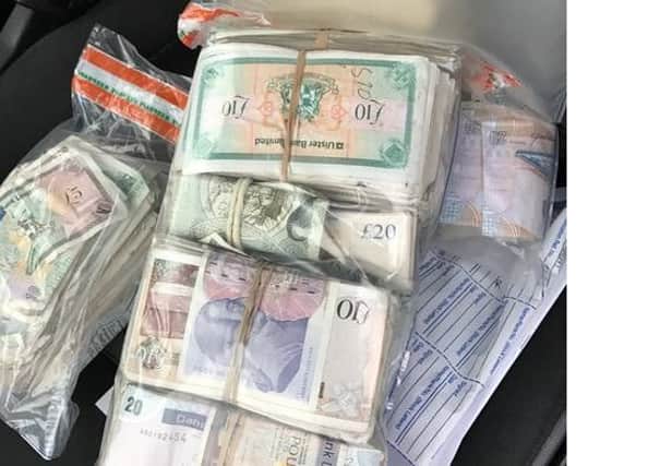 Some of the cash seized in the raid. INPT50