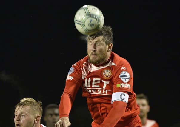 Portadown's Ken Oman has been handed a six game ban by the IFA.