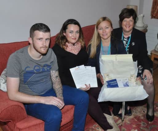 Hannah Kirkpatrick and her partner Markwith representatives of the Causeway Maternity Unit. The donations they received enabled them to purchase Sands memory boxes. INCR 50-741-CON