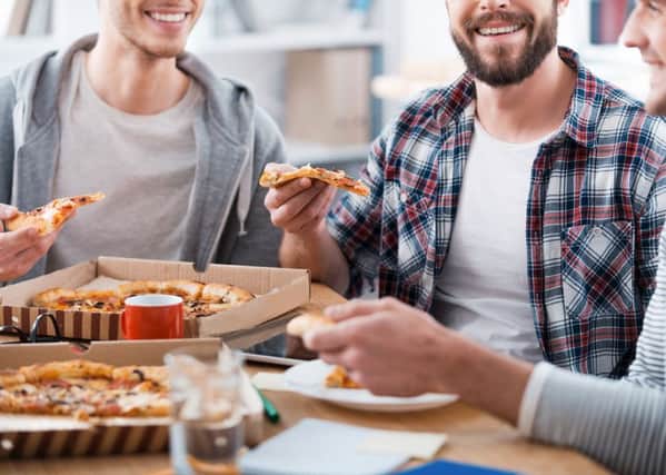 Men are at risk of gorging at barbecues or holiday meals because they see it as a 'Man v Food' style challenge, say scientists.