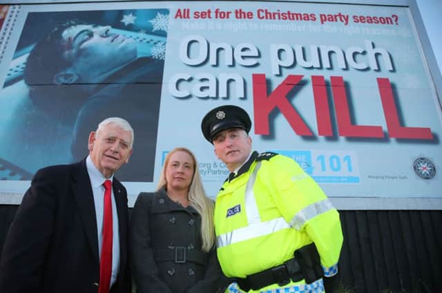 Pictured are Causeway Coast and Glens Policing and Community Safety Partnership Chairperson, Alderman William King, PCSP Officer Melissa Lemon and PSNI Chief Inspector Ian Magee at a billboard promoting the One Punch campaign at the Metropole in Portrush.PICTURE KEVIN MCAULEY/MCAULEY MULTIMEDIA/CCGBC