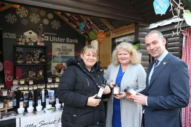 Nicola Pattinson from My Secret Kitchen, pictured with Nigel Walsh, Ulster Bank and Michele Shirlow of Food NI pictured at the Belfast Christmas Market. This year, local companies were also given the opportunity to exhibit their wares at the market thanks to support from Ulster Bank and Food NI.