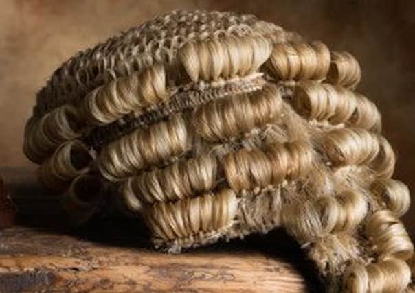 Judge's court wig and hammer or gavel