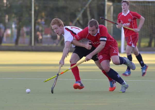 Keith Black competes for the ball with Conor Roberts of Annadale
