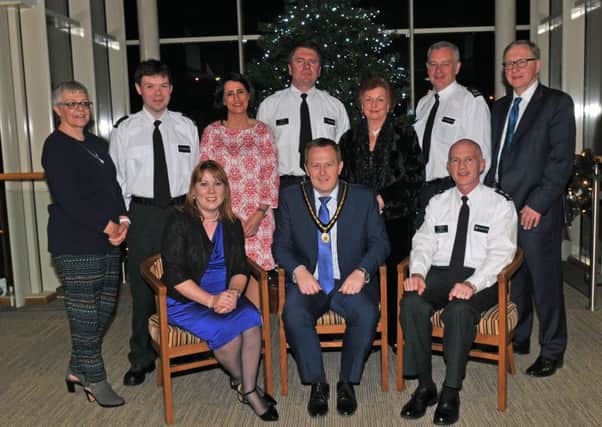 Deputy Lord Mayor of Armagh City, Banbridge and Craigavon, Councilor Paul Greenfield at the PCSP, Neighbourhood Watch Celebration with, front from left, Patricia Gibson, PCSP manager, Inspector Leslie Badger and back from left, Christine Kerr, Constable Shane McDonald, Annette Blaney, PCSP, Inspector Brian Mills, Geraldine Cunningham, Sergeant Billy Stewart and Mike Reardon.