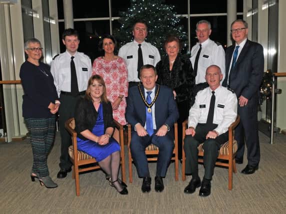 Deputy Lord Mayor of Armagh City, Banbridge and Craigavon, Councilor Paul Greenfield at the PCSP, Neighbourhood Watch Celebration with, front from left, Patricia Gibson, PCSP manager, Inspector Leslie Badger and back from left, Christine Kerr, Constable Shane McDonald, Annette Blaney, PCSP, Inspector Brian Mills, Geraldine Cunningham, Sergeant Billy Stewart and Mike Reardon. INBL Neighbourhood Watch