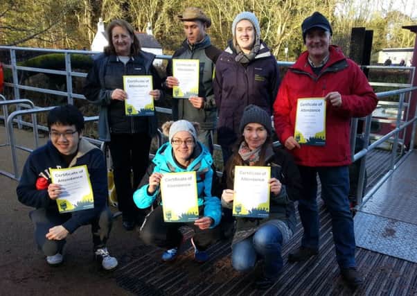 Cathryn Cochrane from The Conservation Volunteers presents some of the trainees with certificates following Lagan Valley Regional Park's Christmas thank you lunch for volunteers.