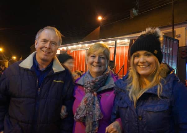 Pictured at the recent Christmas Lights Switch-on event in Ahoghill's Diamond. The Rev Gary Millar co-ordinated proceedings and Heather Murray performed the official switch on. The centre of the village was packed to capacity for the annual festive event. (pictures kindly submitted).