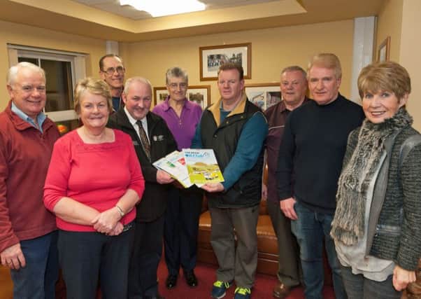 Lexie Scott, Chairman of Broughshane and District Community Association, PSCP member Councillor Reuben Glover, with members of Broughshane Oil Club and Broughshane and District Community Asociation at the launch of the Oil Club calendar in Broughshane House. Included are Betty Millar, Oil Club Chairman Geoff Aiken, Alice Smylie, James Smylie, Laurence Smylie, Sandy Wilson and Maureen Hunter.
