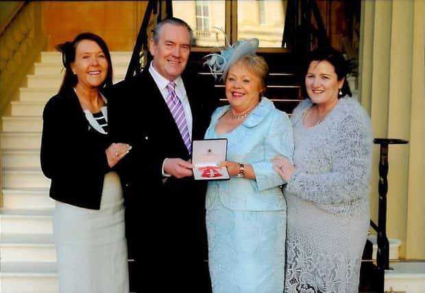 Carrick woman Ann Scott receives her MBE at Buckingham Palace.  (From left): Martina ONeill Operational Manager,SE Trust,  Davy Scott , Ann Scott, Roisin Keown, ward sister, SE Trust. INCT 52-651-CON