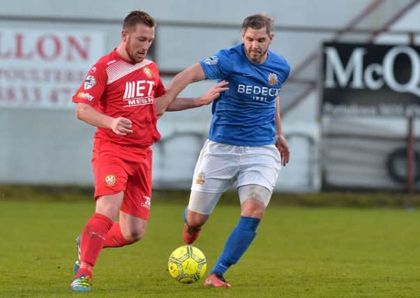 David Elebert (right) up against Portadown's Mark McAllister is the 2-2 draw for Glenavon on Boxing Day. Pic by PressEye Ltd.
