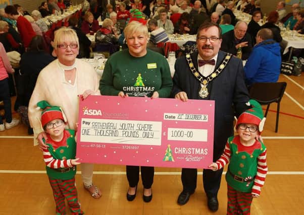Sharon Brash (Senior Youth Worker at Rathenraw Youth Scheme), Barbara Logan (Asda Antrim Community Champion) and Mayor of Antrim and Newtownabbey, John Scott are joined by Aidan and Jamie at the Rathenraw Youth Scheme Christmas party for local senior citizens. (Submitted Picture).