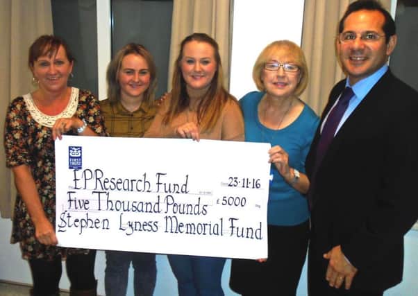 The Lyness family present Â£5,000 to the London Heart Hospital.