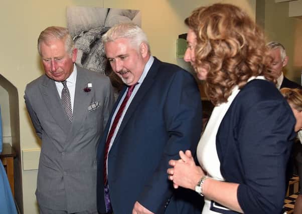 Simon Dougan and wife Jilly with Prince Charles during the visit in July. INPT02-006
