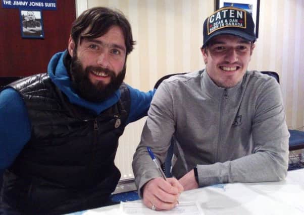 Glenavon manager Gary Hamilton welcomes new signing James Gray (right) to the club. Pic: glenavonfc.com