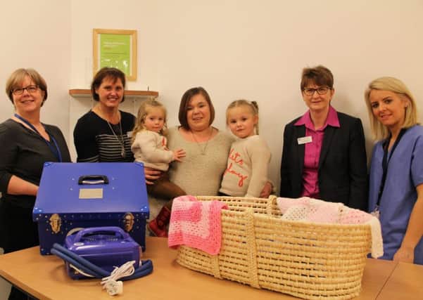 Carly Hall with daughters Darcey and Grace along with Hilary Patterson (Bereavement Support Midwife), Mary Graham (Labour Ward Manager), Zoe Boreland (Head of Midwifery & Gynaecology) and Karen Cross (Staff Midwife).