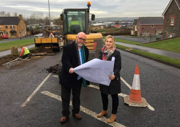 Sinn FÃ©in councillors Michael Goodman and Anne Marie Logue pictured at the start of works for a pedestrian island on Mayfield Link. INNT 01-828CON