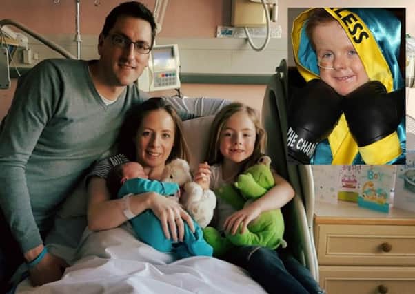 Oscar Knox's parents Stephen and Leona with daughter Lizzie and new son Caspar Henry Knox. Inset: brave wee Oscar Knox.