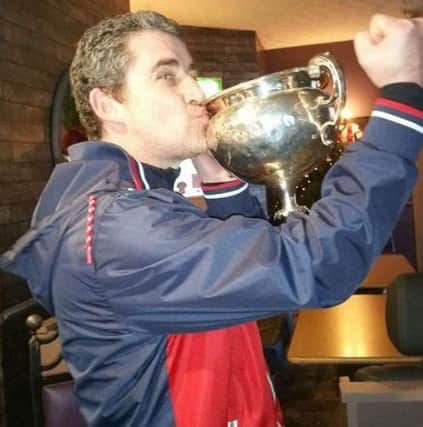 Ardmore Reserves manager Jimmy McAllister celebrates their Supplementary Cup success.