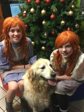 Abigail Mairs (left) and Amelia Galbraith, who will be sharing the title role, along with Milo, who will be playing Sandy.