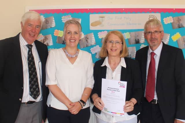 Margaret McAuley (second right) has received a Primary Science Teacher of the Year Award. Included are: Jim Beggs, Primary Science Teaching Trust associate; Mary Mc Cann, principal, St. Marys Primary School, Bellaghy and Mike Rance, chair of trustees, PSTT. INBT 02-651-CON