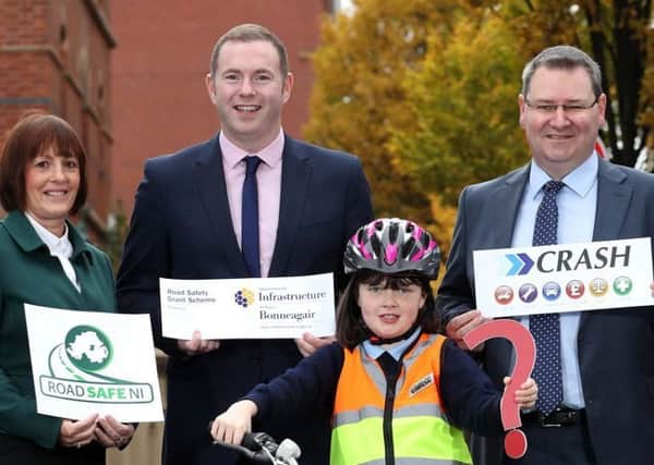 NI Primary School Road Safety Quiz is launched by Department for Infrastructure Minister Chris Hazzard and Megan McKeown. They are joined by Joan Kinnaird from event organisers Road Safe NI and Jonathan McKeown from sponsors CRASH Services.  There are 11 heats in each super council areas in January and February before the NI finals take place in February.