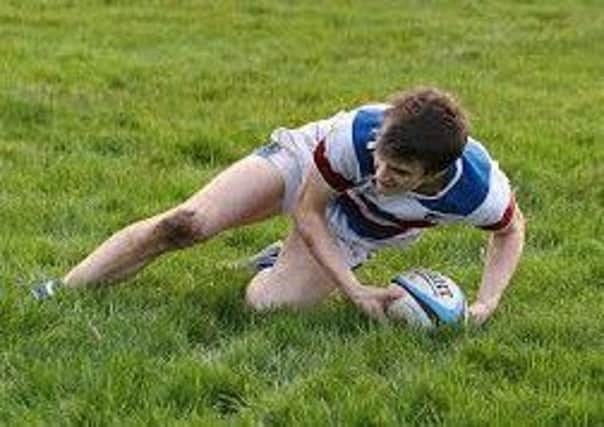 Ross Fallows scores his first try against Larne