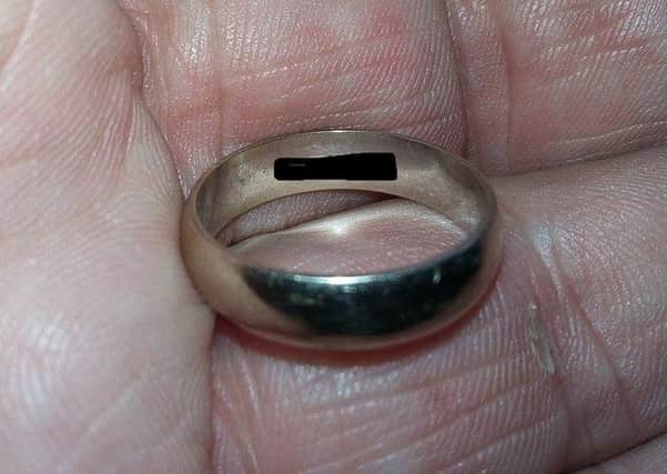 The ring. (The makers mark/inscription is blacked out). INNT 02-825CON