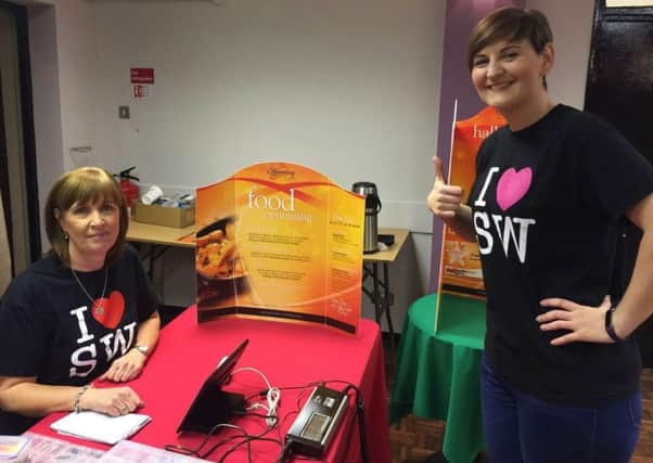 Diane Oliver and Shirley Hussey prepare to welcome newcomers to Slimming World in Carrick. INCT 02-660-CON