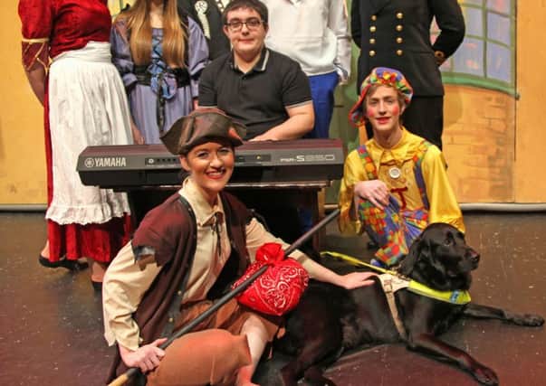 James Cunningham with cast members, with guide dog Bart.