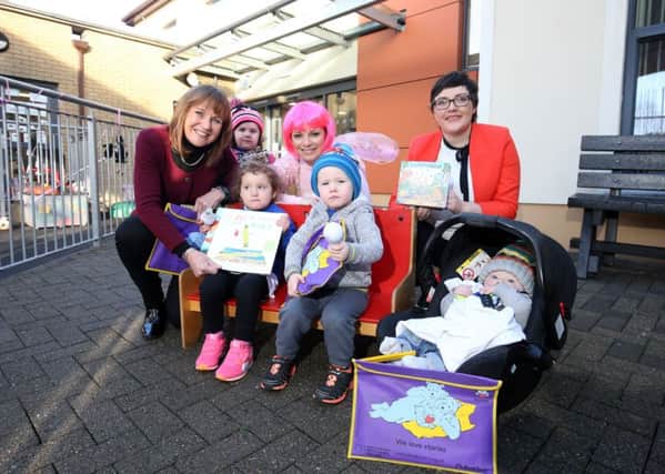 Pictured are Liz Canning (BookTrust NI Manager), Polly Poppet and Alicia Clarke (SONI), along with children who attended the local event.