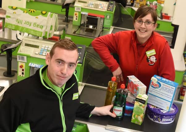 Barry McCafferty from Portadown is one of the eight Princes Trust Get into Retail graduates who were offered permanent positions at Asda. Also pictured is Carolanne Rodgers, Asda Academy Training Manager