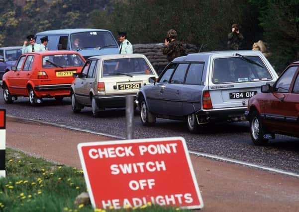RUC and British Army checking cars at the border in the 1980s