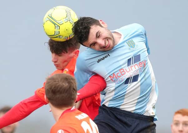Ballymena's Joseph McKinney goes up for the ball. 

Picture by Jonathan Porter/PressEye.com