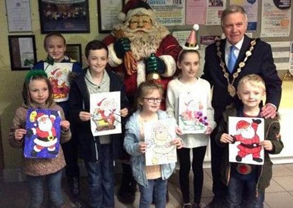Mayor Brian Bloomfield with the winners of the Resurgam Youth Initiative Christmas colouring competition.