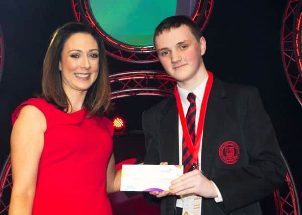 Ruth Murphy presents Alexander Baine, Ballyclare High School, with second place place for his project Augmented Reality Sudoku Solver in the Chemical, Physical and Mathematical Sciences category at intermediate level.