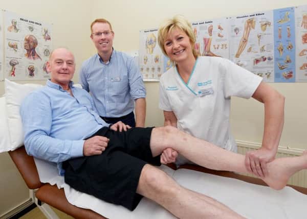Judith Spence, Advanced Clinical Specialist Physiotherapists and Gareth Hampton, Clinical Director for Emergency Care, Southern Health and Social Care Trust with Michael McKiverigan, one of the patients who has benefitted from the new First Contact Physiotherapy Service at Craigavon Area Hospital.