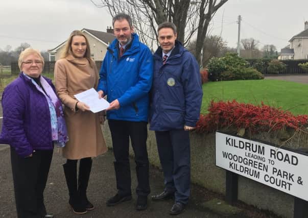 DUP have met Council officials at Woodgreen to hand over a petition signed by almost 100% of the small community requesting Council consider options for a Play park .