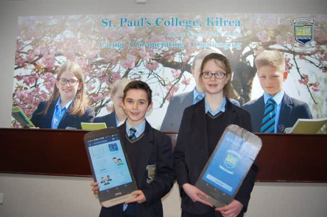 Pearse Maguire and Bronagh Campbell (year 8 students) showcasing their schools app.
