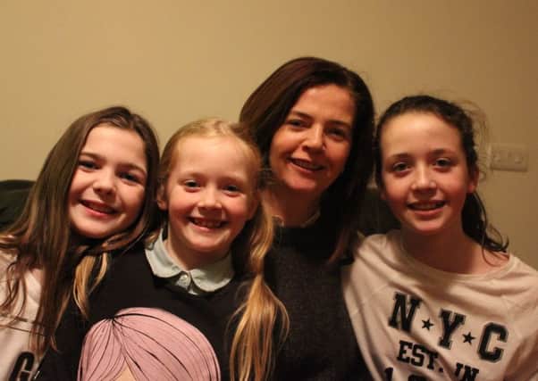 Sinead is pictured with her three daughters
