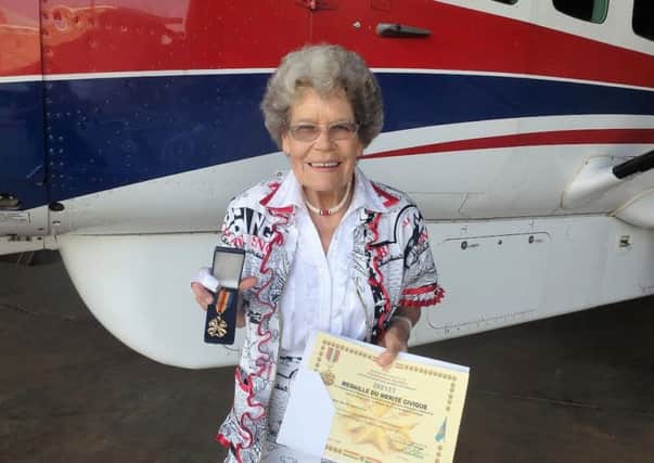 Maud with her medal of merit from DR Congo