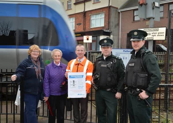 Janet Burns (left) and Muriel Goode with Keith Pollock from Translink and the Larne Local Police Team at Whitehead Railway Station. INCT 05-650-CON