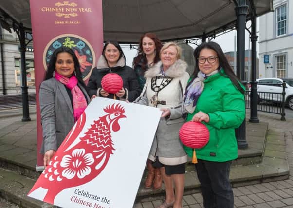 Helping the Mayor of Mid and East Antrim Borough, Councillor Audrey Wales MBE to officially launch Chinese New Year 2017 'The Year of the Rooster' are from left: Ivy Goddard MBE, (Project Director of the Inter-Ethnic Forum MEA), Jane Dunlop (Good Relations Officer for Mid and East Antrim Borough Council); Natasha Taylor (Inter-Ethnic Forum MEA) and Lena Fok (Chinese Community Ballymena).