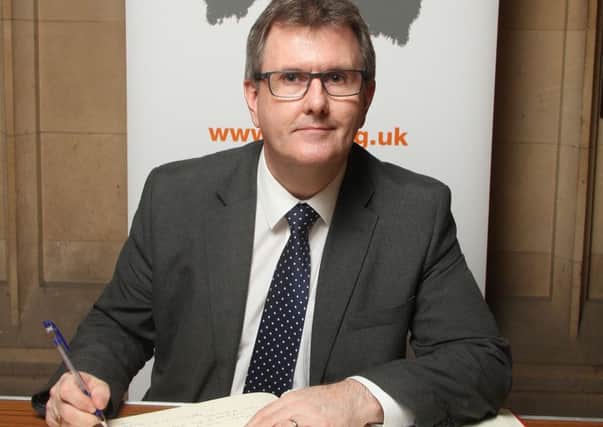 Sir Jeffrey Donaldson MP signs the Holocaust Educational TrustÃ¢Â€Â™s Book of Commitment.